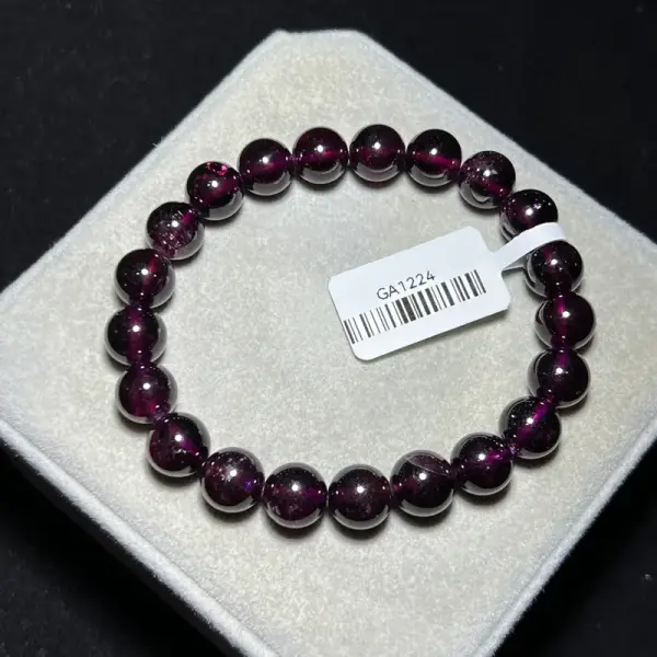 Purple tooth black garnet 9mm GA1224